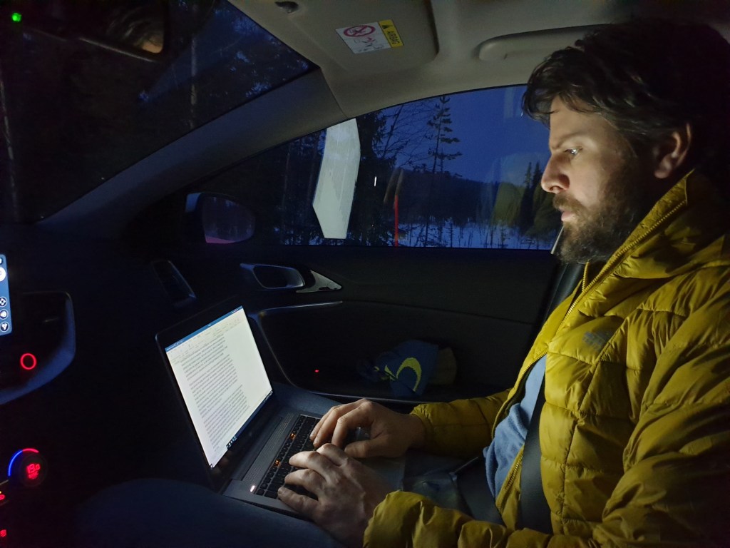 Zander writing the first Part of the Sarek Adventure in the car